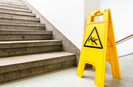 a hazard sign near a staircase