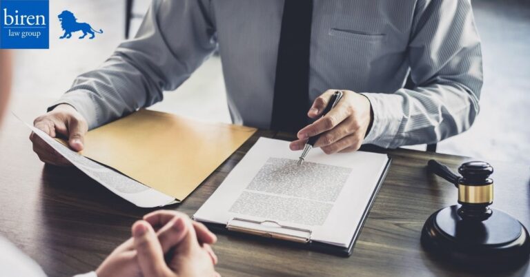 Man with tie outlines a document.