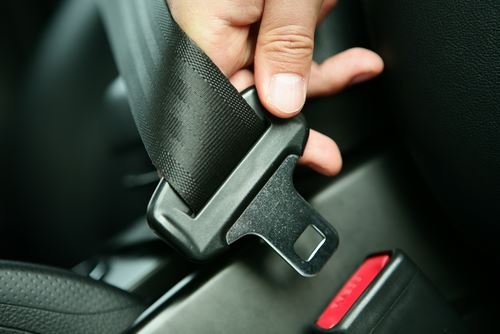 Hand buckling seat belt.