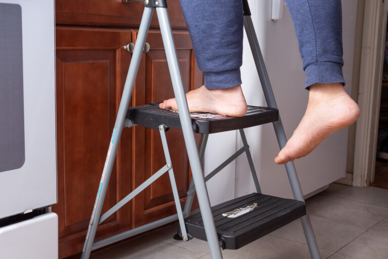 A person standing on a step ladder
